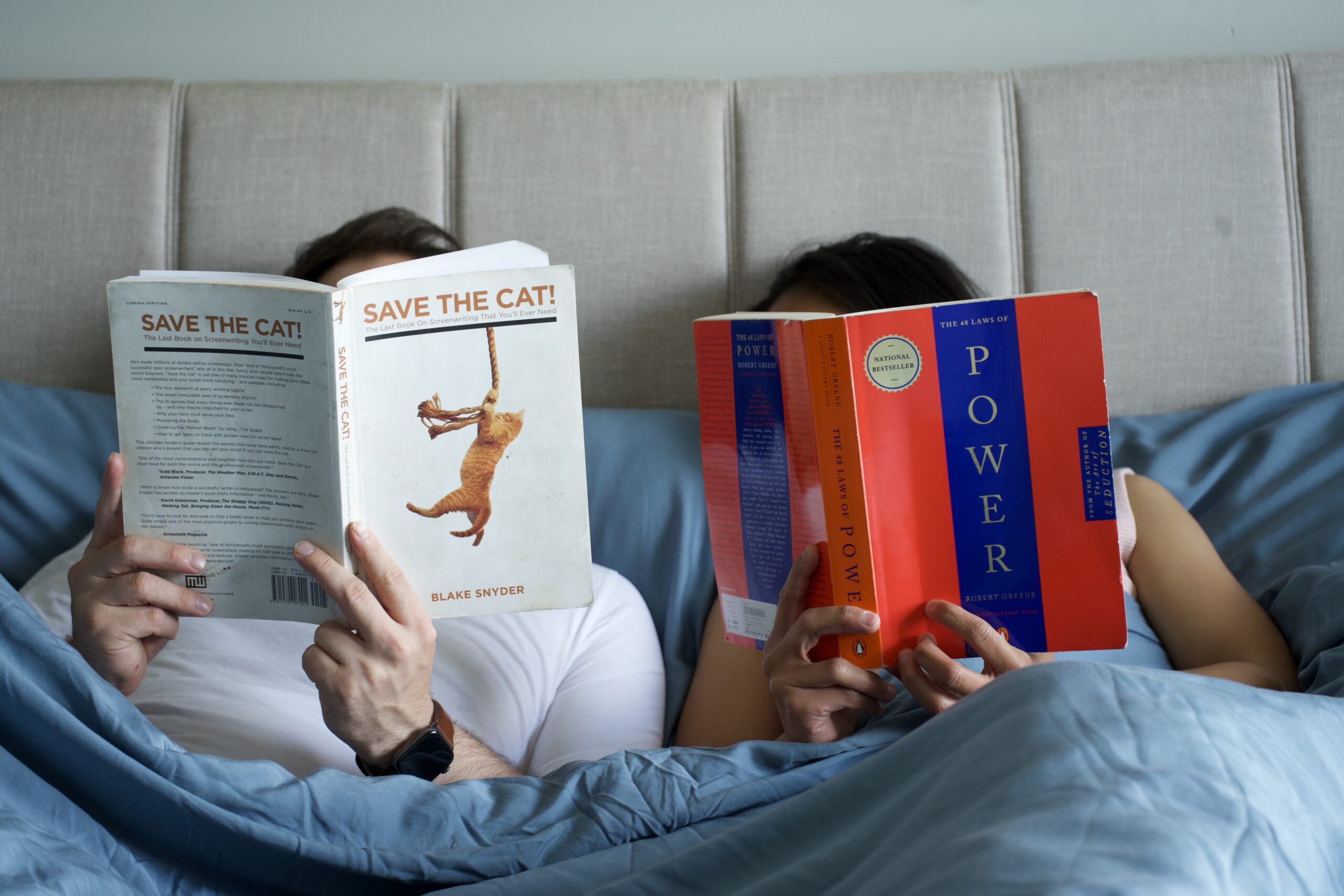 Nick and Eartha reading their non-fiction books in bed