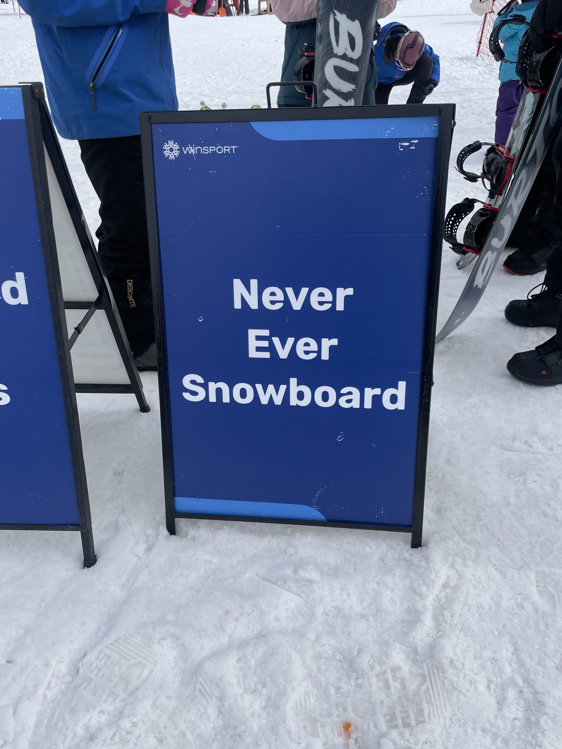 Never Ever Snowboard signage was displayed prominently, indicating the designated area for beginners