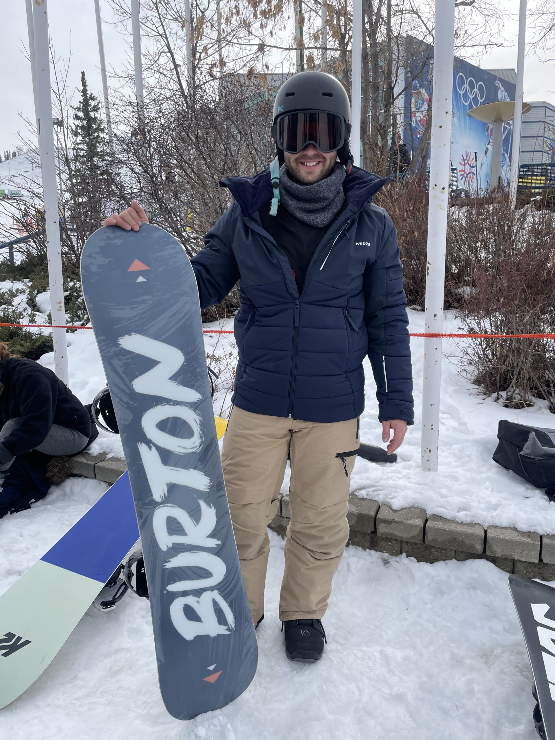 Nick wearing a snowboarding jacket, pants, and goggles from Decathlon